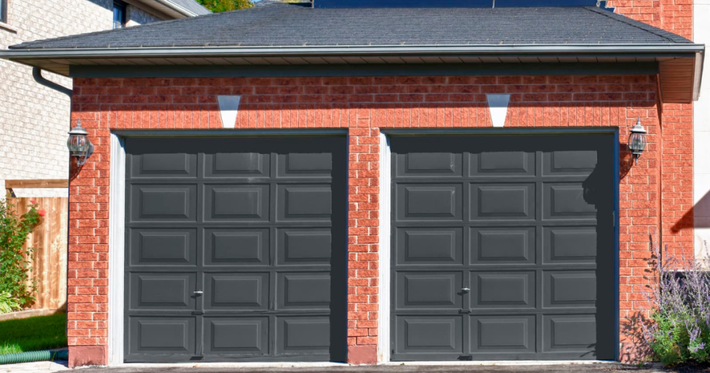 black garage doors on a red brick house