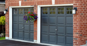 black garage doors on red brick house