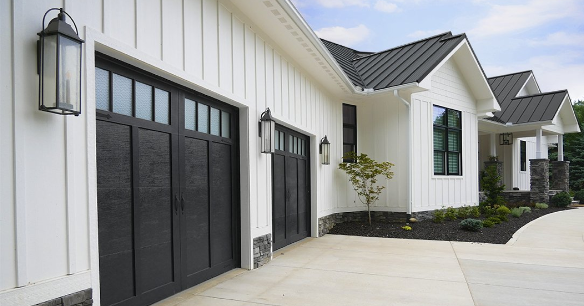 black garage doors on white house